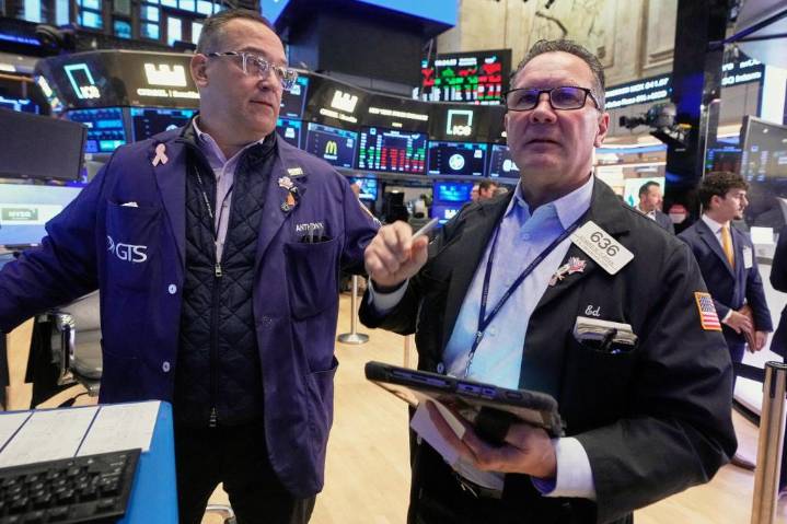 US stocks slip in morning trading as more companies report their results