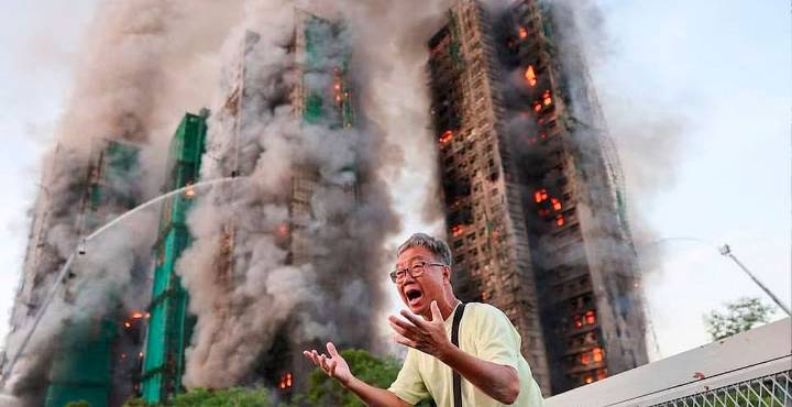 El fuego que rompió a Hong Kong; 83 muertos y cientos de heridos