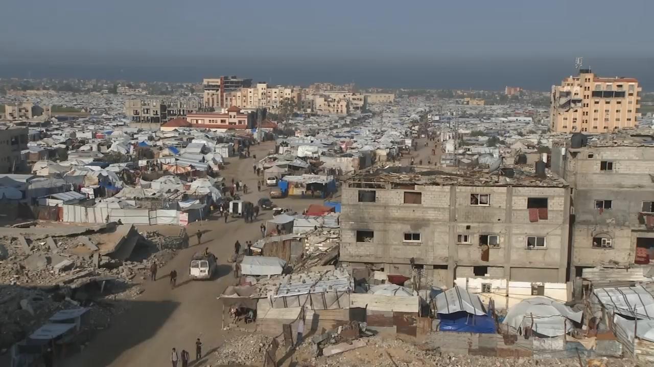 People in Khan Younis react after UN approves Trump administration's Gaza plans