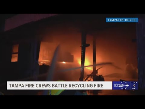 Tampa Fire Rescue crews get flames under control at a recycling facility