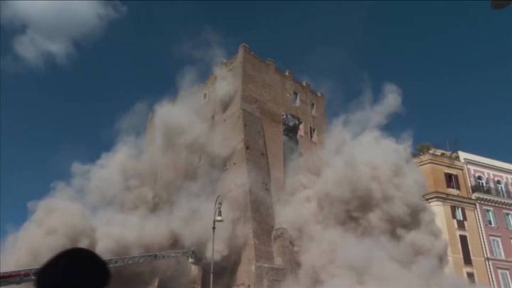 A medieval tower in Rome partially collapses with a firefighter inside