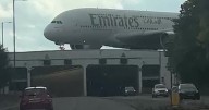 Incredible video shows giant Airbus A380 landing over motorway