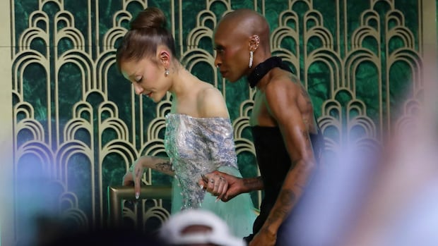 Ariana Grande rushed by fan on Wicked: For Good carpet in Singapore