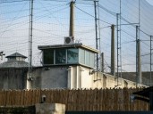 France catches one of two escapees in bed