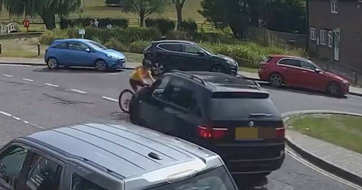 Moment new BBC Children in Need boss crashes into cyclist in his BMW SUV before quitting