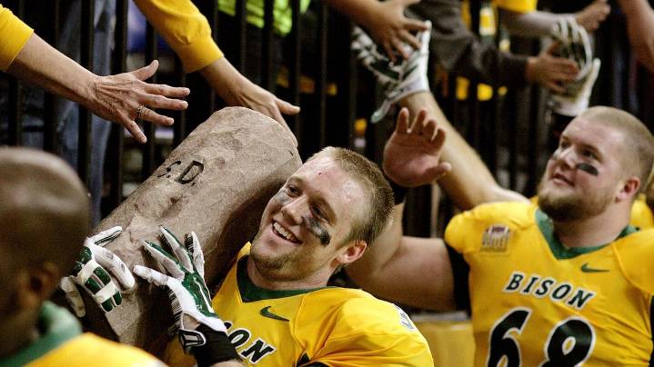 Origin stories behind the trophies heighten college football rivalry games on the smaller stage