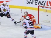 Zayne Parekh leaves after heavy hit, Flames get blanked by Blackhawks