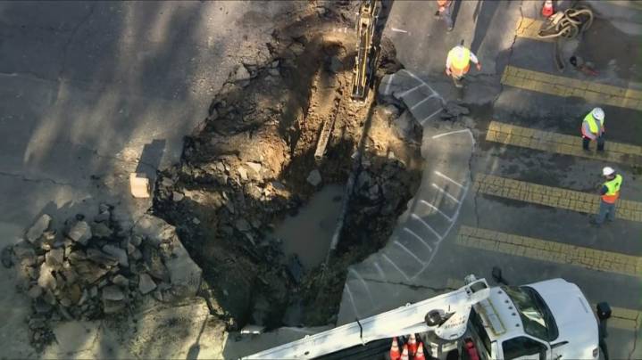 Water main breaks causes massive sinkhole in Woodland Hills