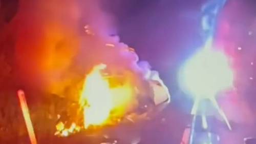 New Jersey police pull driver from car fire in dramatic rescue