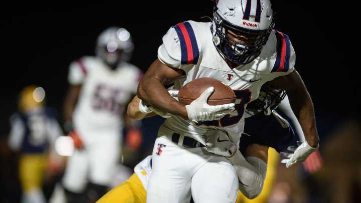 What NC football standouts are climbing the recruiting ladder in Round 1?