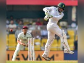 Muthusamy’s maiden Test ton help SA cross 400