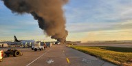 Massive fire erupts at Kentucky airport after UPS plane crash