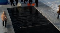Swimmers brave the ice in Russia