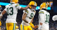 Love matches career high with 4 TD passes, lifting Packers to 31