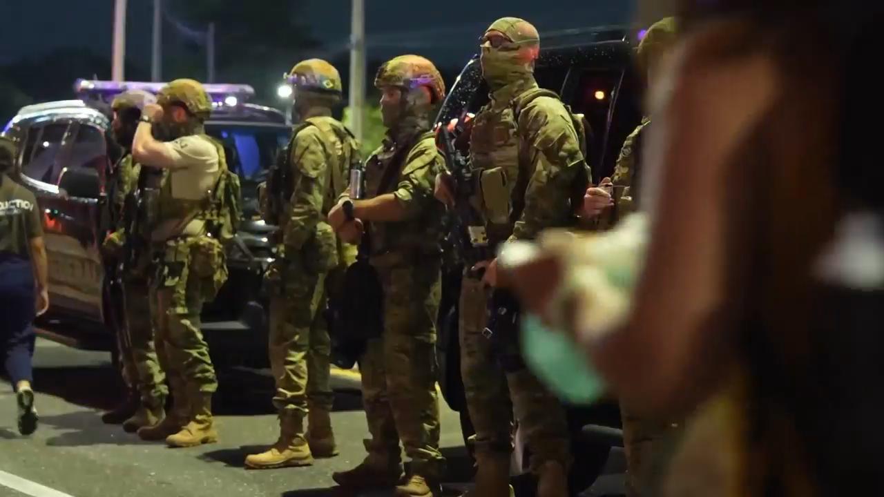 Witnesses react after protestors confront security outside COP30 venue