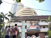 Sensex, Nifty open flat, experts say volatility to continue