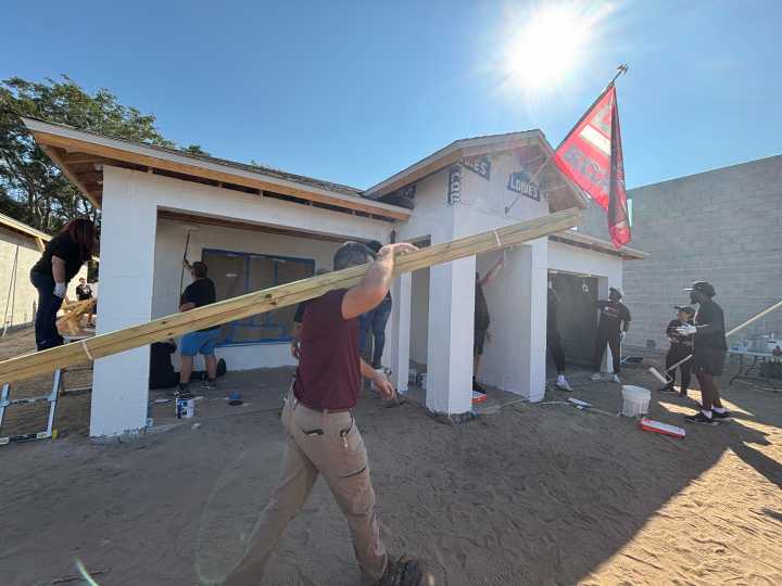 Tampa Bay Bucs players and personnel join in Habitat home building for the holidays