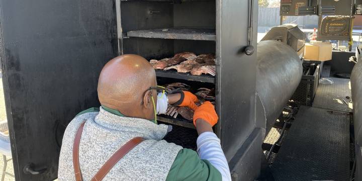 Wichita Wagonmasters smoke hundreds of Thanksgiving turkeys for families in need