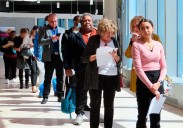 Fewer Americans sought unemployment benefits last week as job cuts stay low