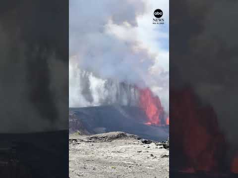 Funnel cloud of ash forms next to spewing lava in Hawaii
