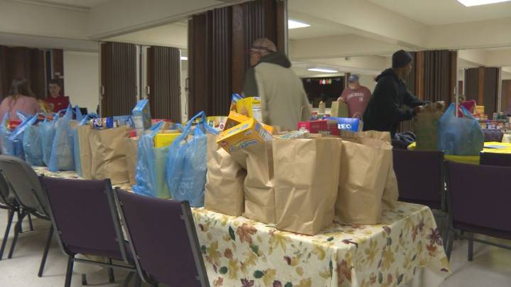 'Love in action.' | Charlestown church packages food donations for community in need