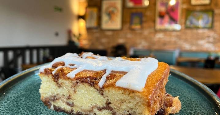 Cute coffee shop on a hill already has customers queuing out of the door