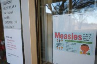 Why did Canada lose its measles elimination status?