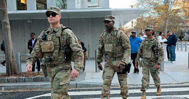 Billboards Urge National Guardsmen to Refuse Orders from Trump Admin