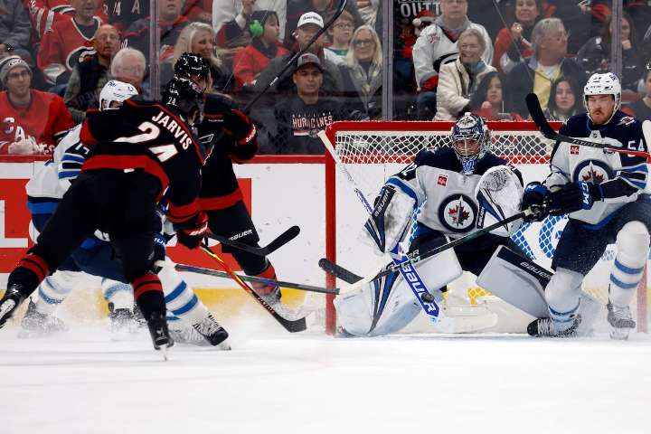 Jarvis scores hat trick as Hurricanes rout Jets