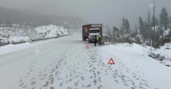 Snow, jackknifed big rig among Sierra I