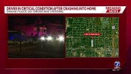 Driver crashes into Omaha home, critically injured