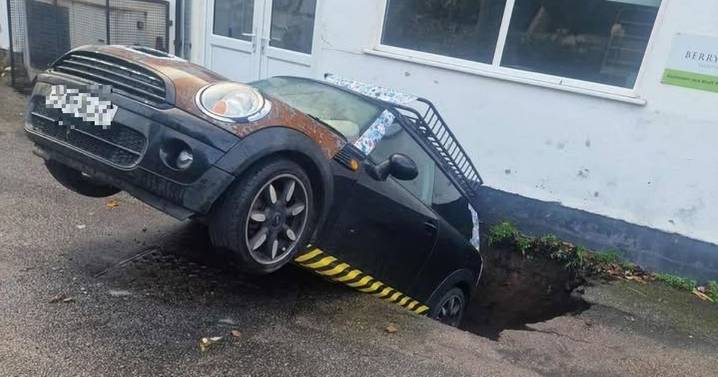 Mini in danger of being 'eaten' by giant freak sinkhole