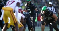 Moore throws 2 TD passes and No. 6 Oregon derails No. 16 USC's CFP hopes with a 42