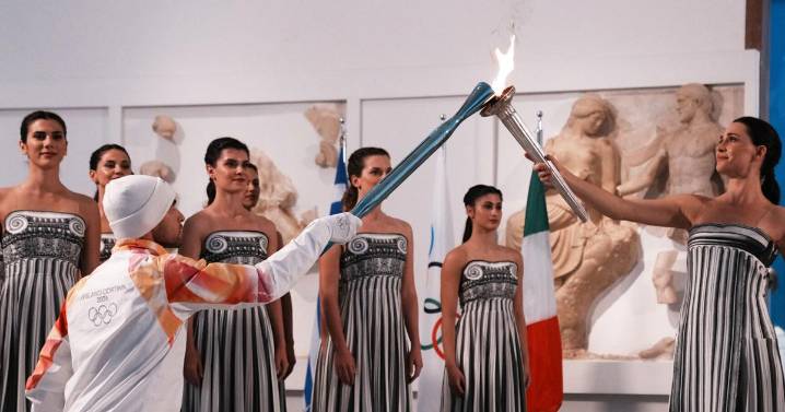 Under a cloud, the Olympic flame begins its journey to the Milan Cortina Winter Olympics