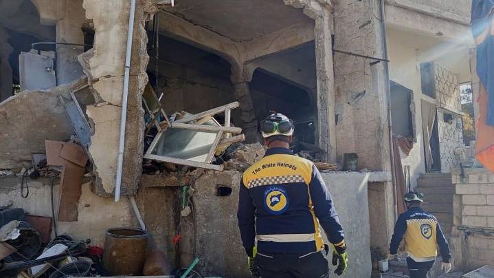 Israeli forces kill at least 13 people in southern Syria raid, officials and residents say