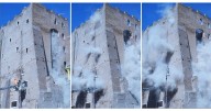 Rescuers work to reach worker trapped in medieval tower that partially collapsed in Rome