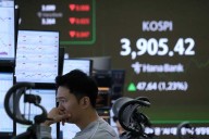 Asian shares rise, taking their cue from Wall Street's winning streak