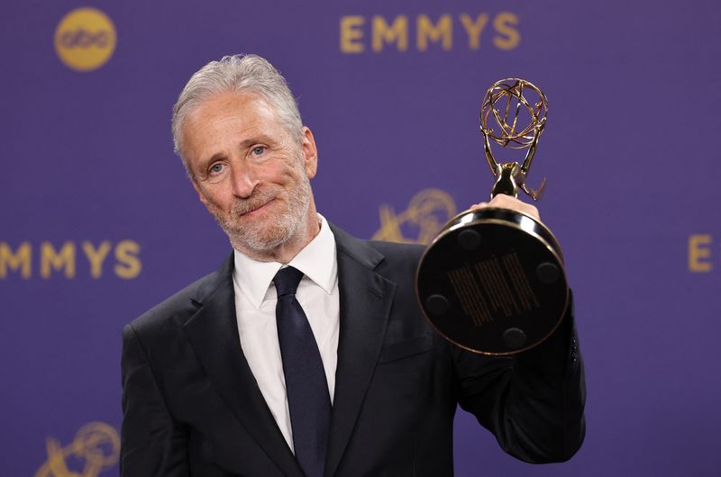 Jon Stewart will remain at the helm of ‘The Daily Show’ until next December