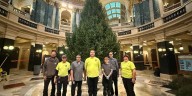 Capitol crews raise Oconto County Christmas tree in rotunda