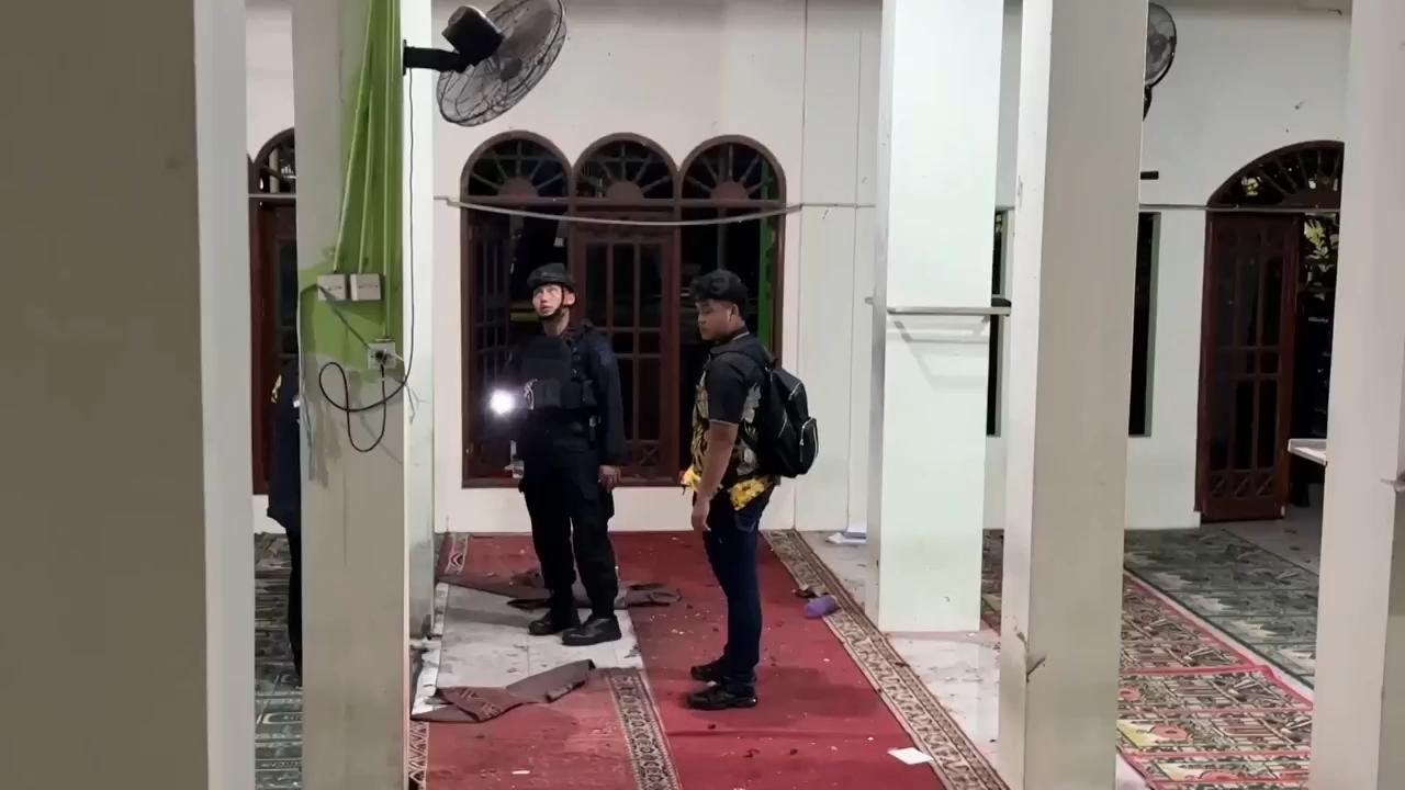 Multiple explosions shake a mosque in an Indonesian high school and injure dozens