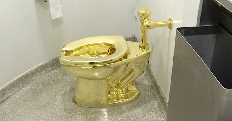 Golden toilet flushes out the uber rich at NYC auction