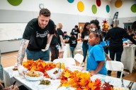 Hartenstein serves meals, spreads holiday cheer for Thanksgiving at Positive Tomorrows