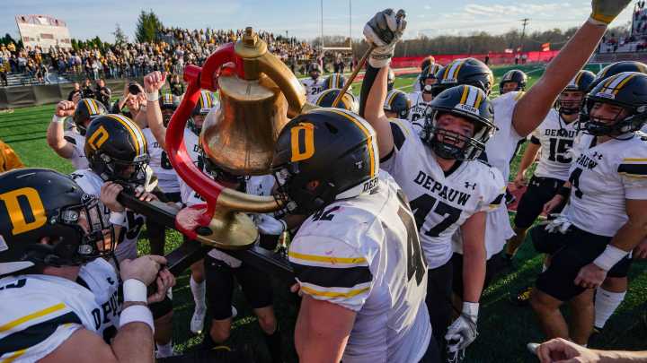 DePauw wheels the Monon Bell and rings it in victory after a win at Wabash