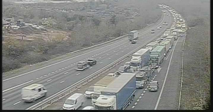 M56 LIVE updates as all traffic STOPPED on motorway amid 'police incident'