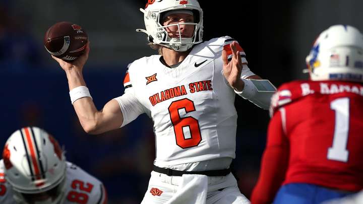 How did QB Zane Flores, OSU football grade in loss to Kansas?