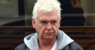 Phillip Schofield cuts glum figure as he picks up Mini from garage after Jaguar crash