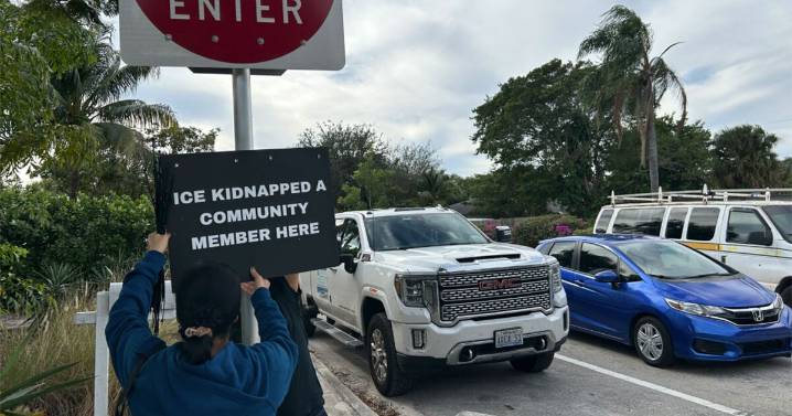 Immigration advocates post signs throughout Lake Worth Beach after recent arrests