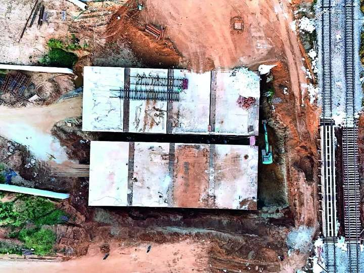 BDA slides concrete boxes beneath live tracks