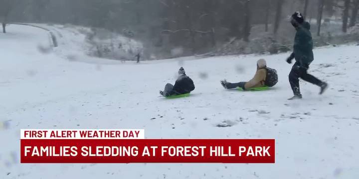 Families enjoy snow day at Forest Hill Park