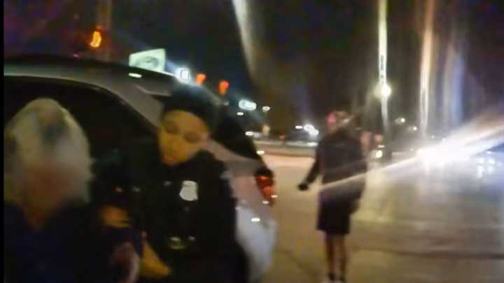 BWC: Mich. officers, bystanders carry injured woman away from vehicle crash